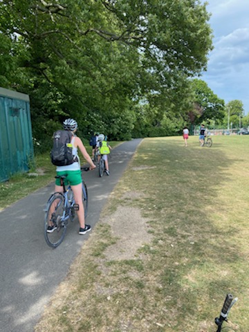 Cycling from Tennis lesson in Malahide Demesne Tennis Courts - Helen Jack Charlie