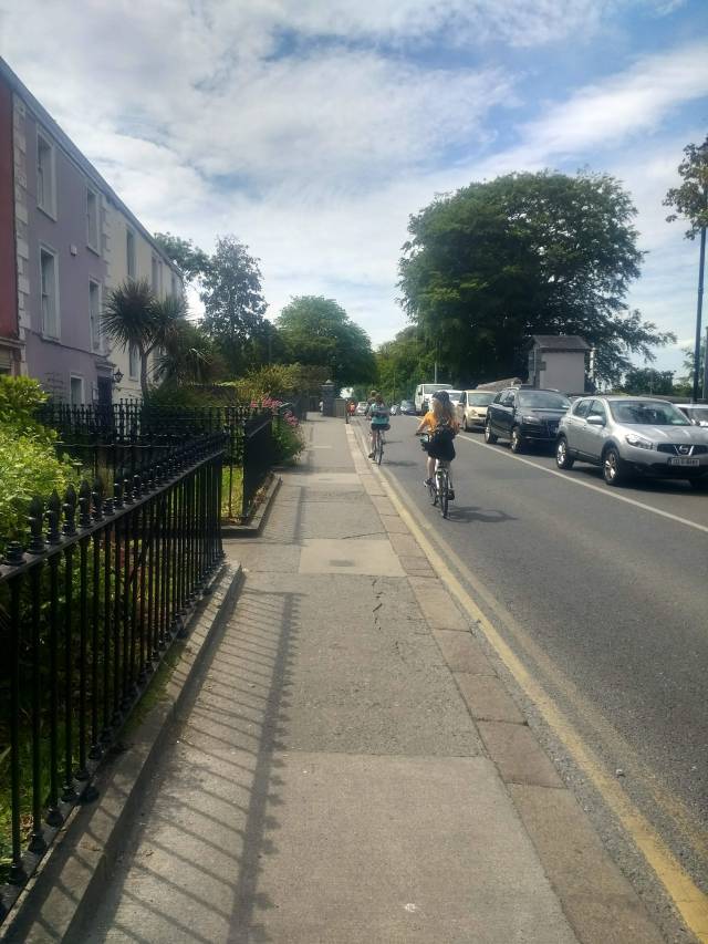 Cycling to Malahide Demesne over Railway Bridge - younger people