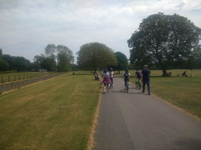 Family walking and cycling in Malahide Demesne